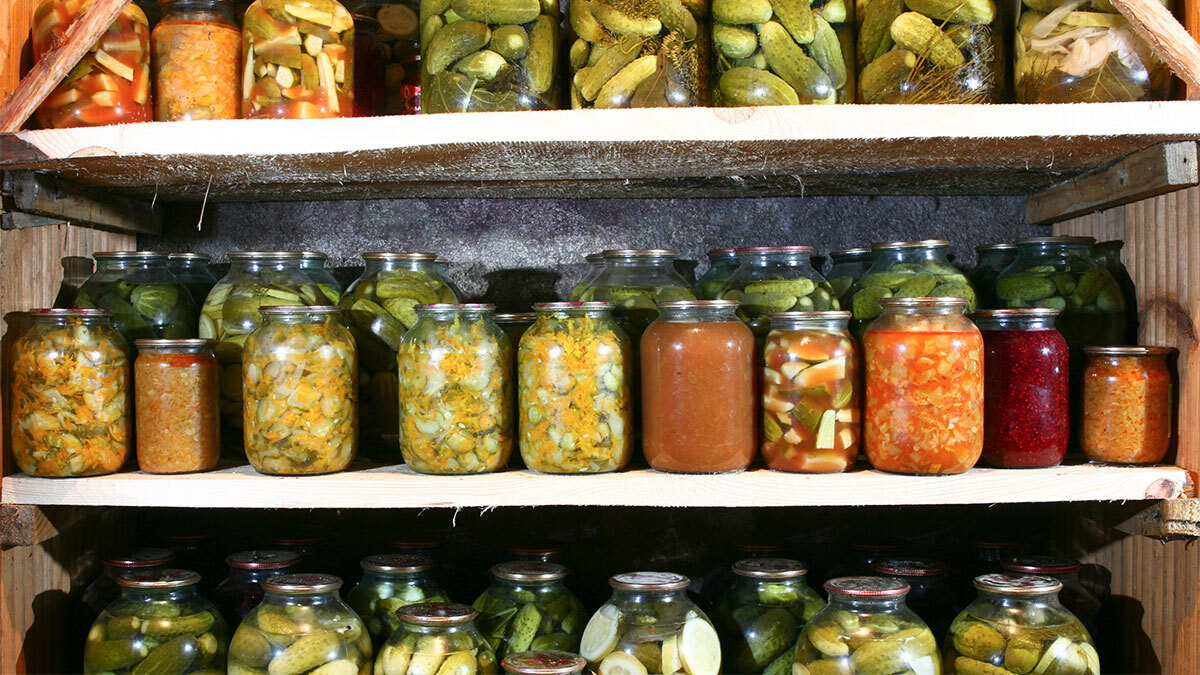 Rows of homemade canned food in cold storage.